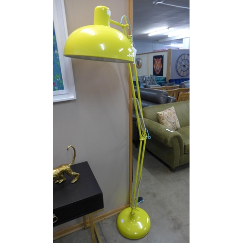 1339 - A yellow floor standing angle poise lamp