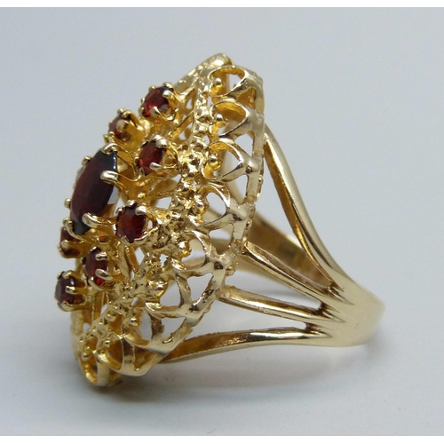 1066 - A 9ct gold and garnet ring, 6.3g, M