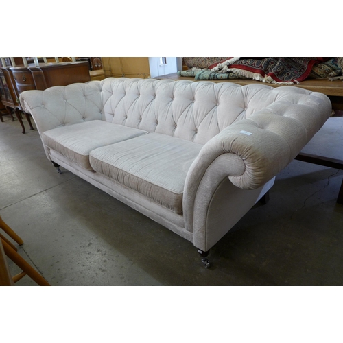 221 - A Victorian style fabric upholstered Chesterfield settee