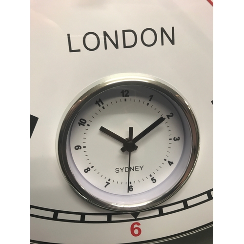 1381 - A black multi dial clock