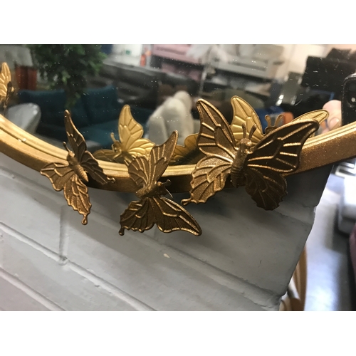 1389 - A gold circular butterfly mirror