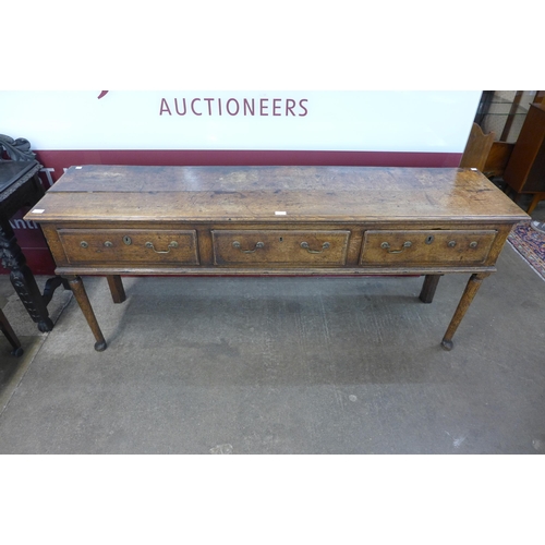 10 - A George II oak three drawer dresser