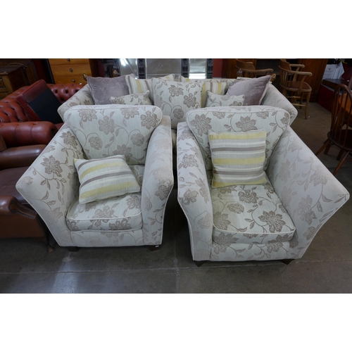 101 - A fabric upholstered Knole drop-arm settee and pair of matching armchairs