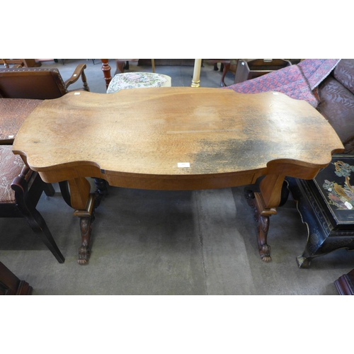 147 - A Victorian style walnut single drawer library table