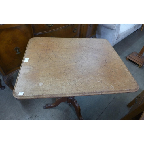 179 - A Victorian mahogany rectangular tripod wine table