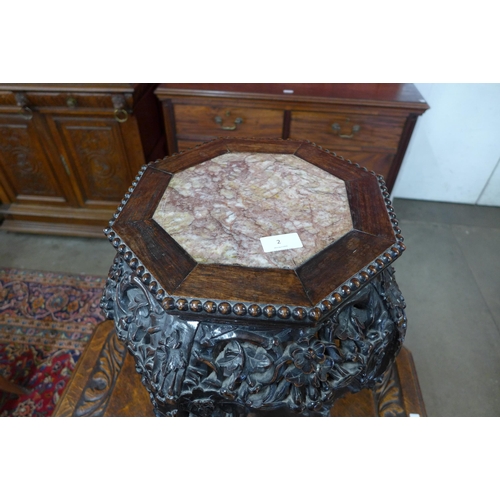 2 - A late 19th Century Chinese carved rosewood and marble topped octagonal jardinere stand