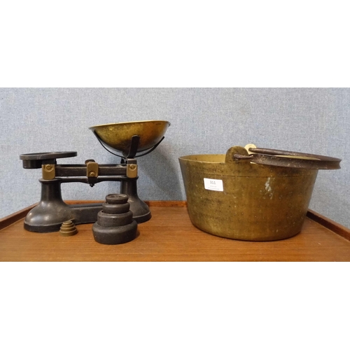 311 - A Victorian brass jam pan and a set of kitchen scales