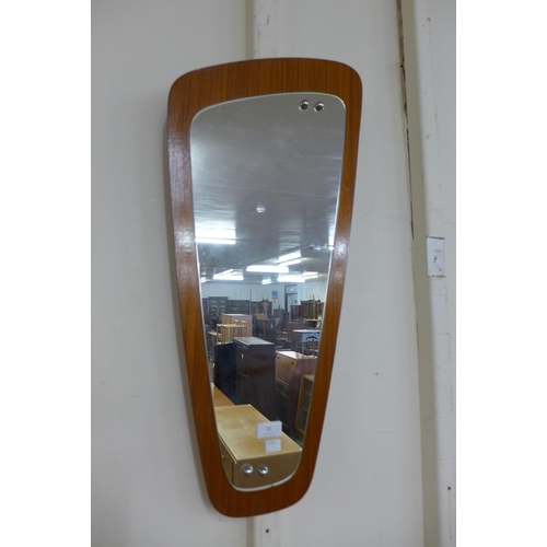 33 - A teak framed mirror