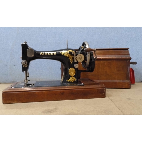 335 - A cased Singer sewing machine (F6623815)