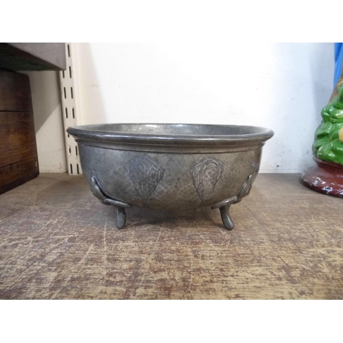 349 - An Arts and Crafts hammered pewter bowl and three copper jugs