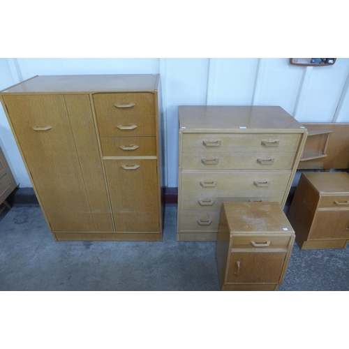 36 - A G-Plan Brandon light oak bedroom suite, comprising; a chest of drawers, tallboy, dressing table, p... 