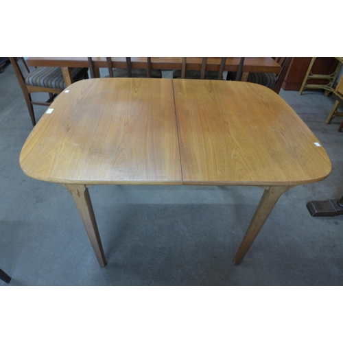 39 - A Nathan teak extending dining table