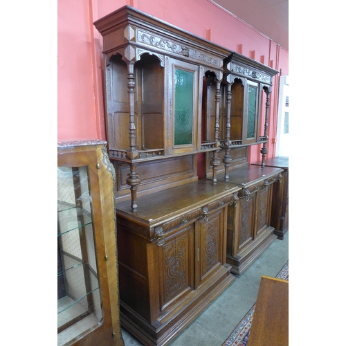 4 - A pair of 19th Century French Henry II style carved oak side cabinets