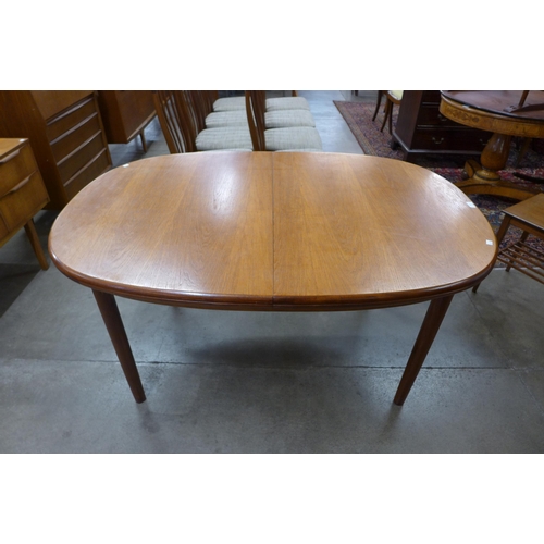 42 - A McIntosh teak extending dining table