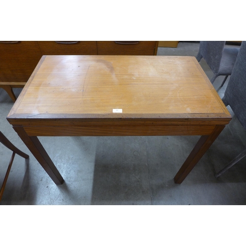 47 - A teak rectangular fold over games table