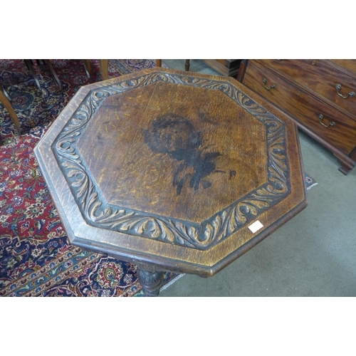 7 - A Victorian Jacobean Revival carved oak octagonal centre table