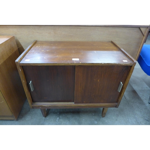 79 - A teak two door record cabinet