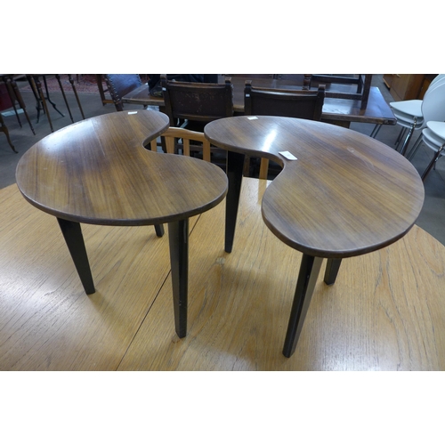 81 - A pair of tola wood kidney shaped coffee tables