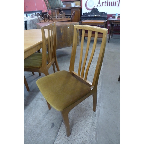 82 - A Sutcliffe of Todmorden S-Form teak extending dining table and four chairs