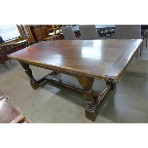 99 - A 17th Century style oak refectory table