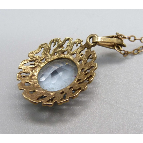 1012 - A 9ct gold and blue stone pendant and chain, 3.5g