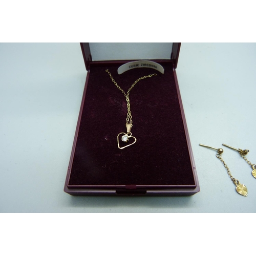 1050 - A 9ct gold bracelet, a pair of 9ct gold earrings and a 9ct gold necklace and pendant, total weight 3... 