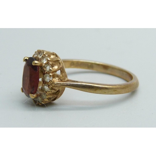 1052 - A 9ct gold and stone set ring, 2g, J