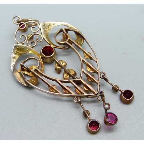 1057 - An Edwardian 9ct gold, red stone and pearl set pendant, 4.8g, 28mm wide