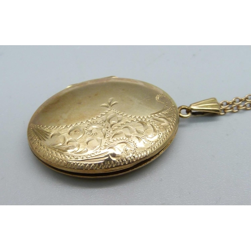 1060 - A 9ct gold locket and chain, 9.8g