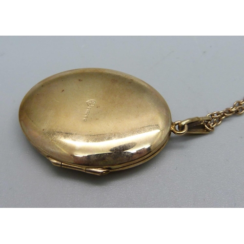 1060 - A 9ct gold locket and chain, 9.8g