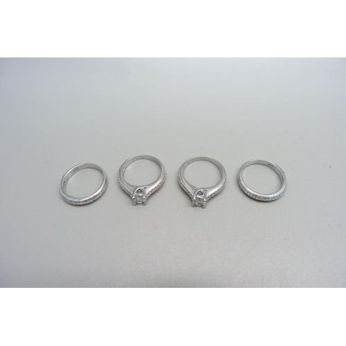 1072 - Four silver dress rings, stamped S925, new unused