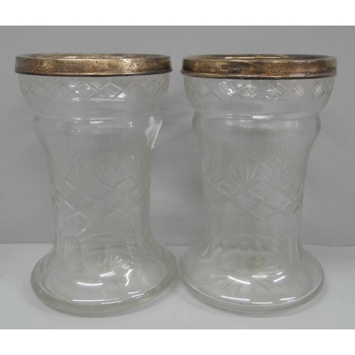 603 - A pair of late 19th/early 20th Century silver rimmed cut glass vases