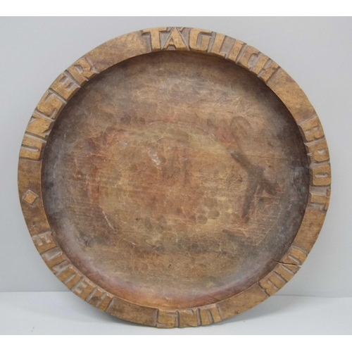 604 - A German carved wooden bread plate, Oberammergau makers mark carved to base