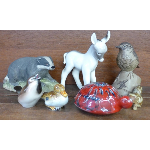 627 - Seven ceramic animal and bird figures; Aynsley badger, Lomonosov donkey, Poole robin, two Goebel bir... 