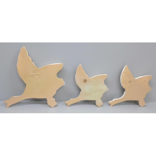 650 - A set of three flying ducks wall plaques