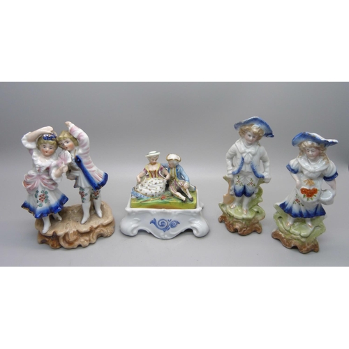 662 - A collection of continental figures and a double inkwell with figural top