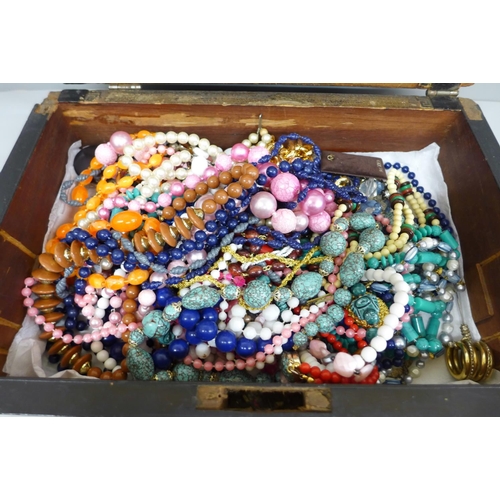 664 - A collection of costume jewellery in a rosewood box