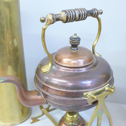 716 - Two WWI brass shells and a copper spirit kettle on a brass stand