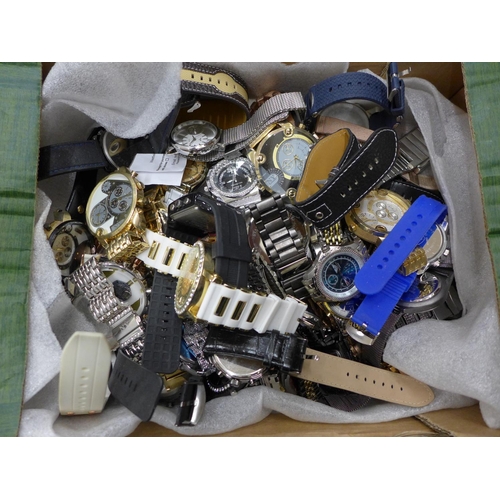 723 - A box of mixed fashion wristwatches