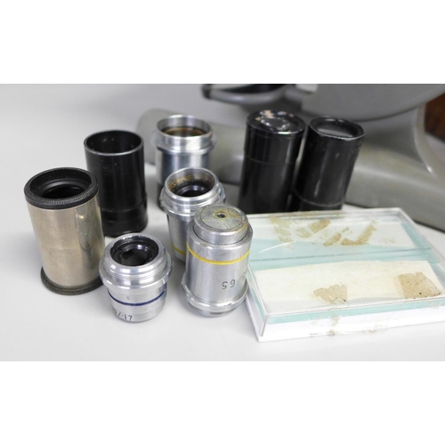 815 - A cased Beck microscope, model no. 47 and a collection of microscope lenses