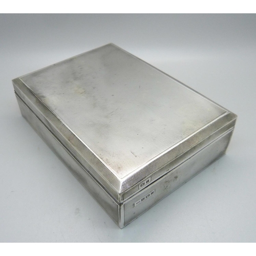 897 - A silver cigarette box, 16.5cm wide