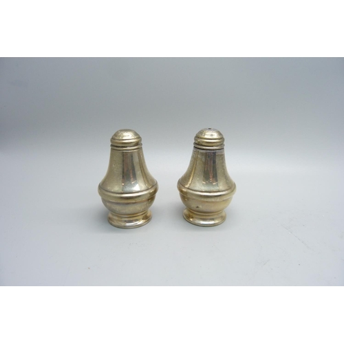 898 - A silver salt and pepper pair, 74g