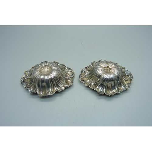 915 - A pair of American Art Nouveau silver embossed dishes, Petunia and Cineraria, 52g, 7cm x 8cm