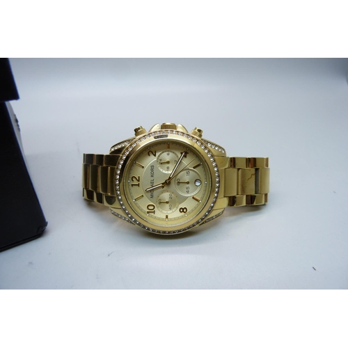 927 - A Michael Kors wristwatch, boxed, case back loose