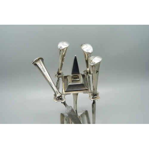 941 - A silver Art Deco manicure stand, Birmingham 1935, with four tools