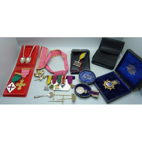 944 - A silver and enamel jewel, other lodge medallions and three silver spoons, weight of silver 71g