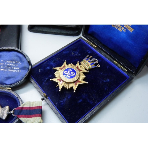 944 - A silver and enamel jewel, other lodge medallions and three silver spoons, weight of silver 71g