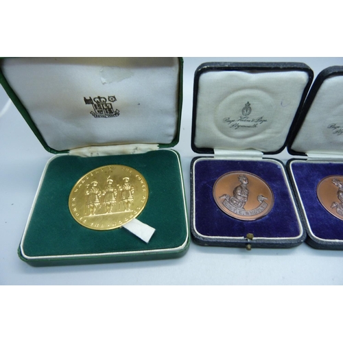 953 - Three Royal Military Tournament medals, R.N.T.E. Shotley, cased, and a Royal Mint HM Tower of London... 