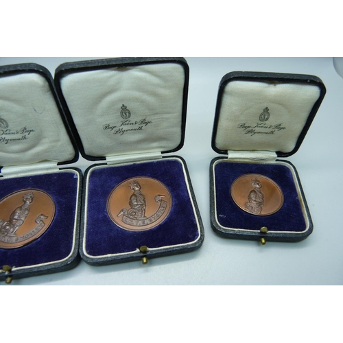 953 - Three Royal Military Tournament medals, R.N.T.E. Shotley, cased, and a Royal Mint HM Tower of London... 