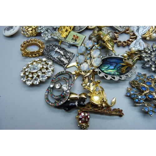 A collection of vintage costume brooches